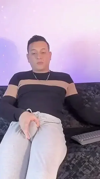 Latino Shows off His Bump on Camera Inside His Gray Sweatshirt
