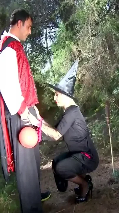 Big tits MILF sucks a huge cock while another thrusts her pussy in the wild