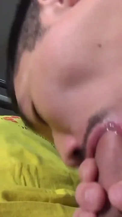 Young Asian boss at the feet of a bodybuilder master