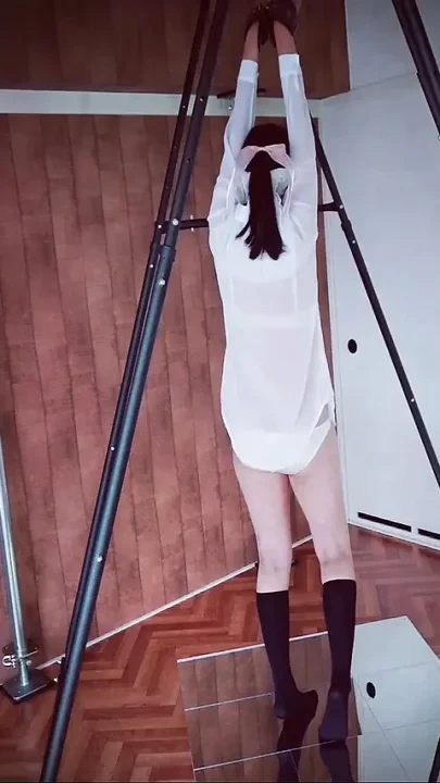 A Woman in a Shirt and Underwear Enjoys Bondage Play