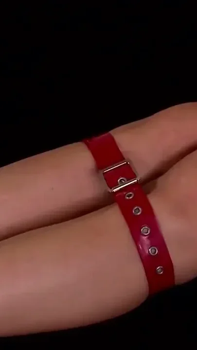 Bound Beauty in Red Straps Teased on Red Bed