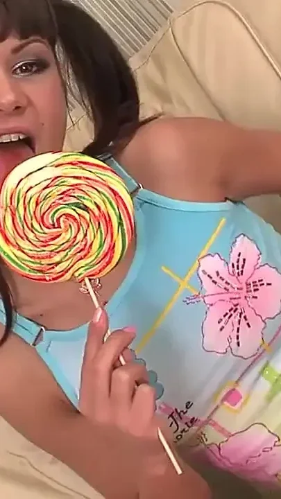 Handsome Man Pounds Wet Cunt of a Cute Teen on Armchair While She Sucks a Huge Lollipop