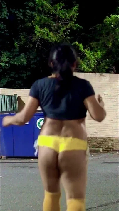 More sexy walking outdoors in yellow shorts