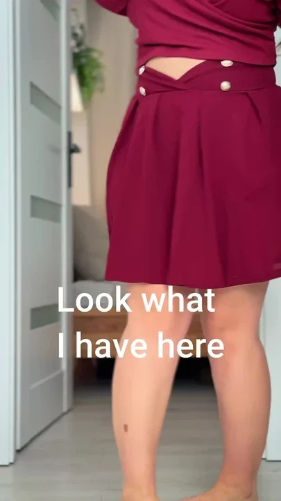 My wife's bum peeking out from under her lovely skirt