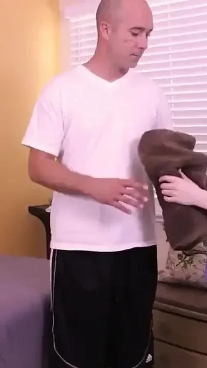 Long-haired Dolly with Natural Tits Ties Him to a Massage Table and Jerks Him off