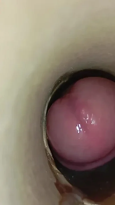 The Dirty Dude Takes Out His Cock Full of Semen From the Tube and Plays with the