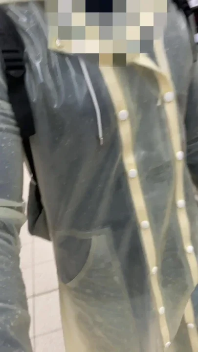 Wearing transparent latex raincoat in public