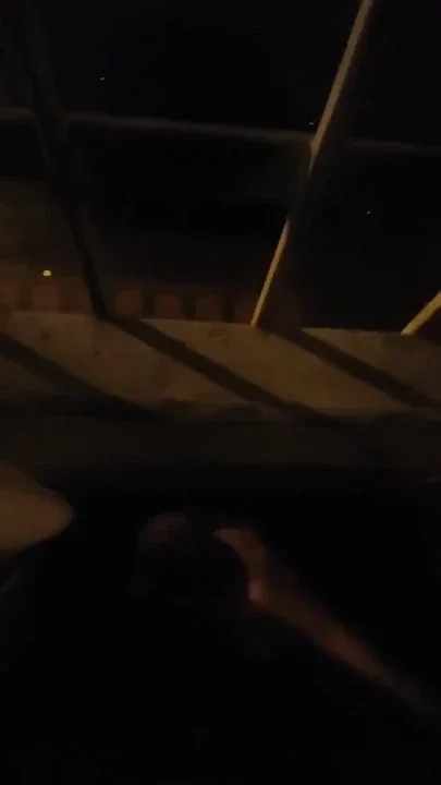 Playing on the window with cars passing by