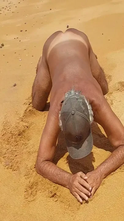 Ladysilva on all fours on the beach wanting cock in her ass