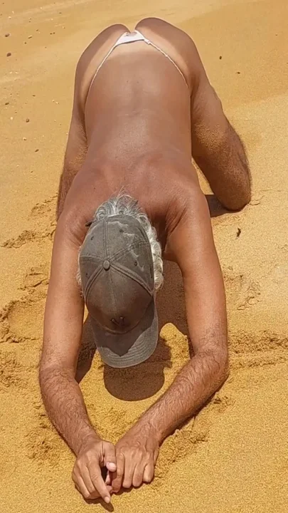 Ladysilva on all fours on the beach