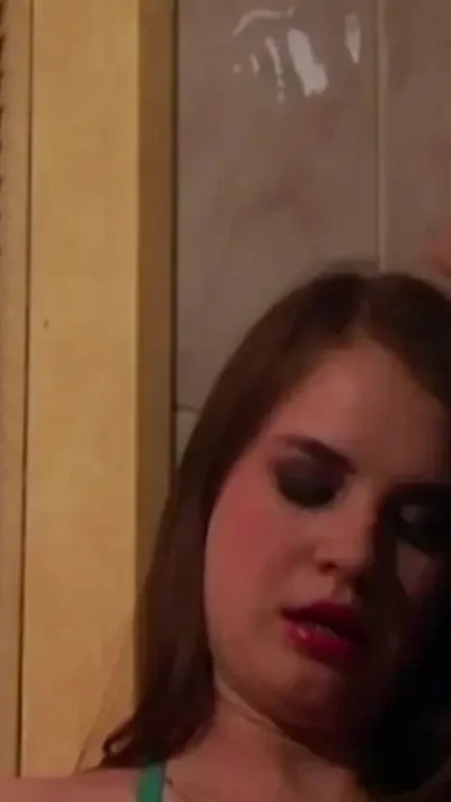 Busty babe smoking at the bathroom