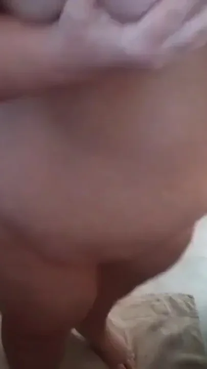 John is taking a big piss on Jen's big boobs