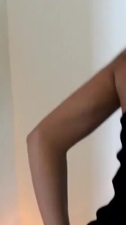 Asian hottie dancing next to candlelight