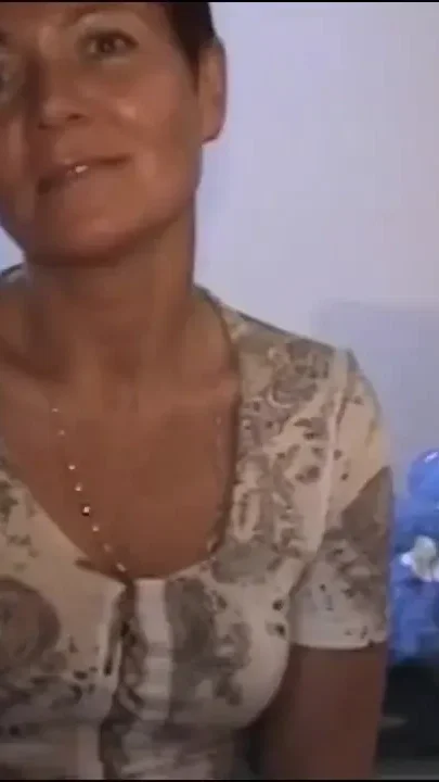 Mature brunette does it to herself after showering