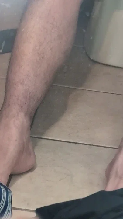 In the bathroom naked rubbing my slippery brown dick with a glove