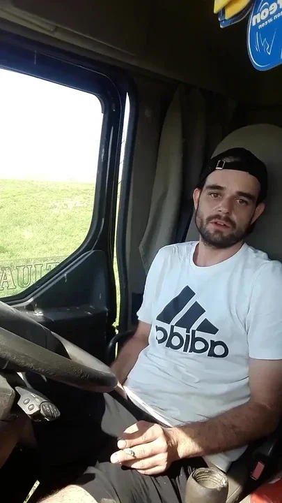 Jerking off in Shorts in a Parked Truck and Smoking a Cigarette