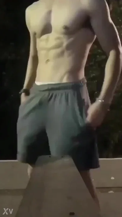 Stepbrother exercising in the park sneaking up