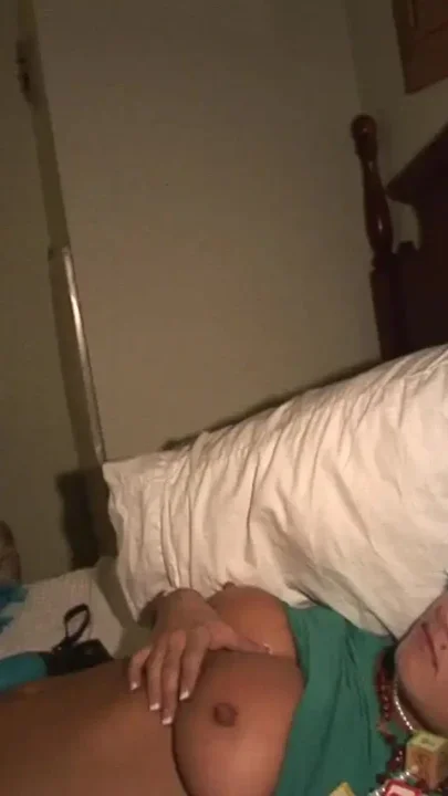 Festive girls naked fun on the bed