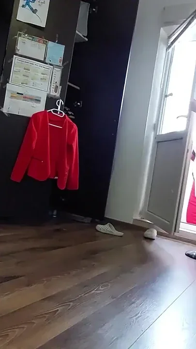 Amateur woman has fun trying on clothes and cutting them Clip 1
