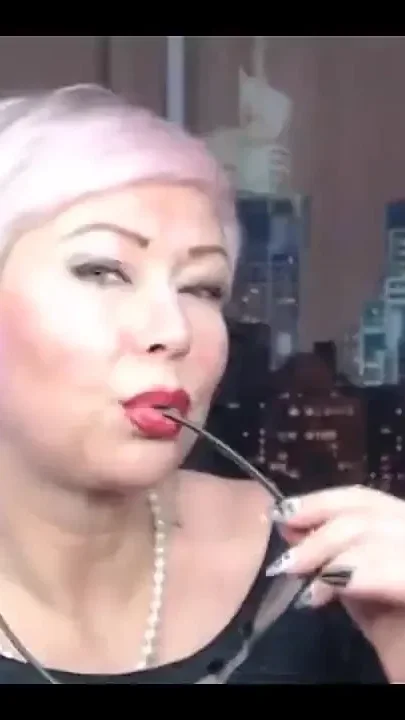 Sexy Old Whore with a Rose in Her Blonde Hair Desperately Fucks Herself in a Private Show