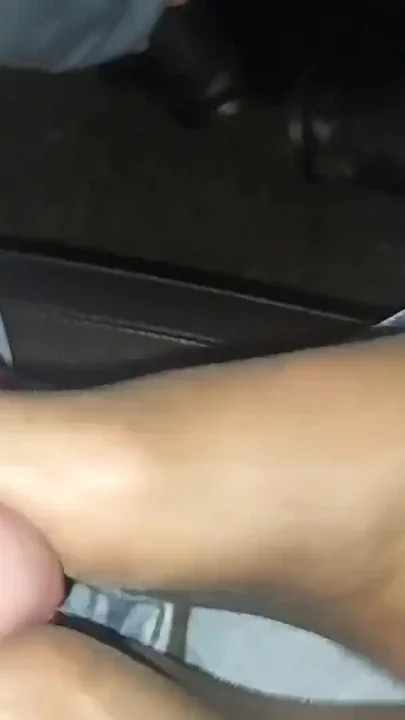 Mature stepmom gives her stepson a nylon footjob in the car in public Clip 2