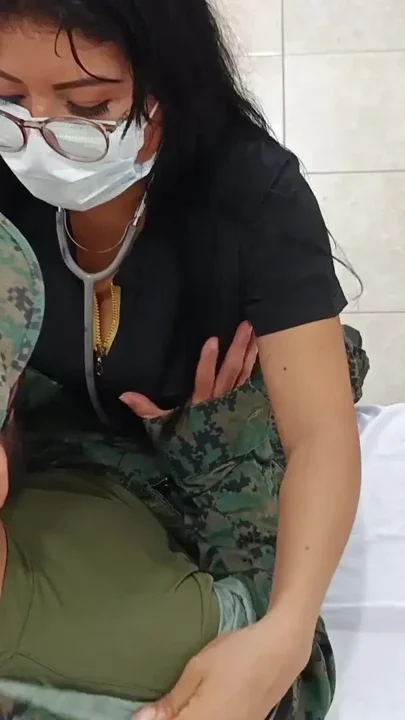 A doctor sensually gropes a soldier in the doctor's office during a consultation Clip 1