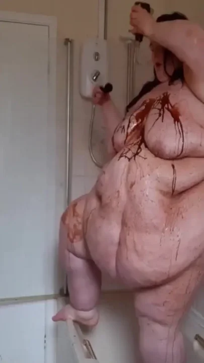 Ssbbw body covered in chocolate sauce in shower