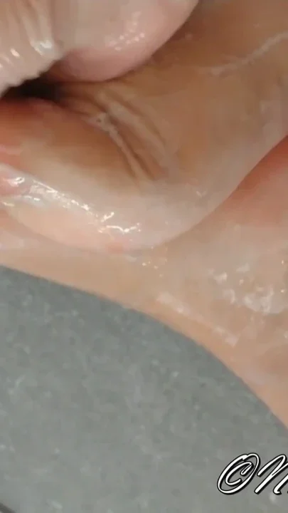 Dildo footjob in the shower with soap