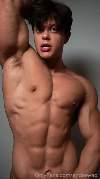 Young musclegod licking his own biceps