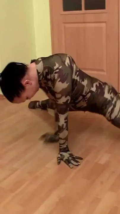 flexi girl stretched by her trainer