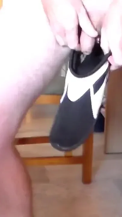 John is peeing all into his shoe