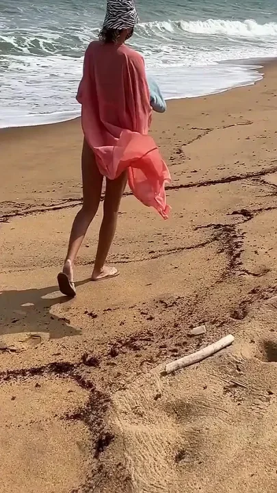 A Busty Blonde Is Walking and Sunbathing Naked