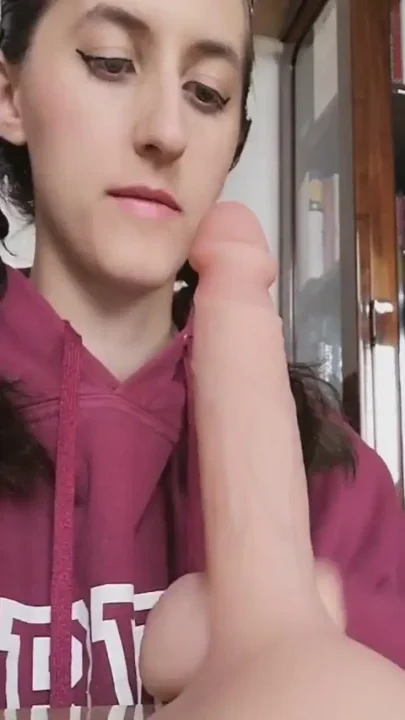 Blowing a huge dildo