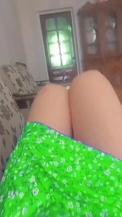 Playful femboy teasing with skirt in windy street Clip 1