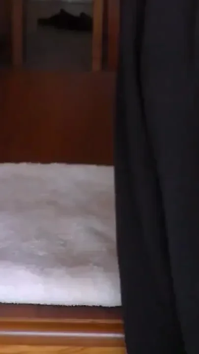 John is taking a big piss on the towel on the table
