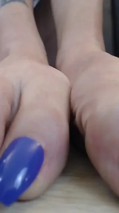 Closeup super long purple toenails