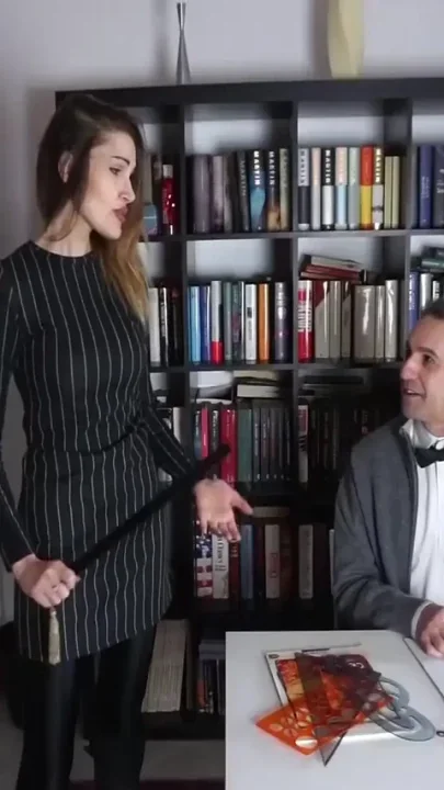 Femdom chick punishes her male slave in the office