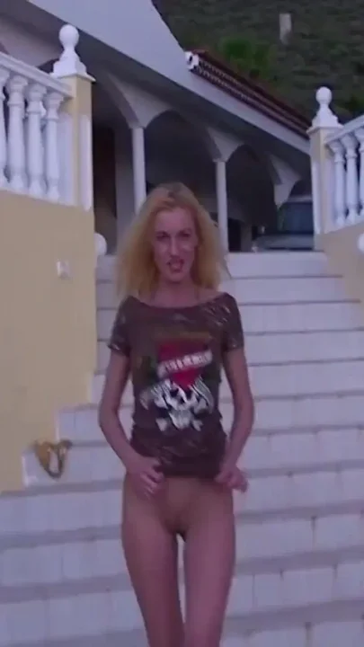 Blonde pissing on the stairs
