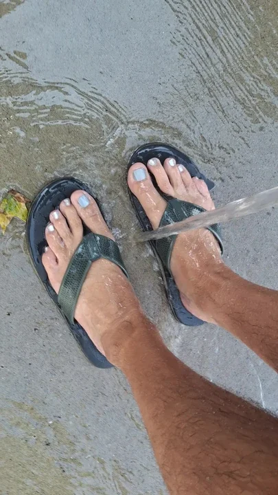 Washing my dirty feet and flip flops