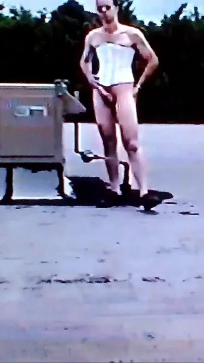Crossdresser Riding a Giant Dildo on a Roof Top