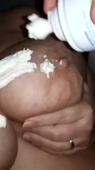 John is rubbing in whip cream on Jen's big tits