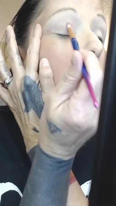 Doing make up dangling smoke