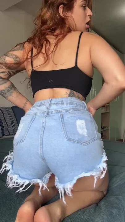 Naughty redhead flashing her ass asking for cock