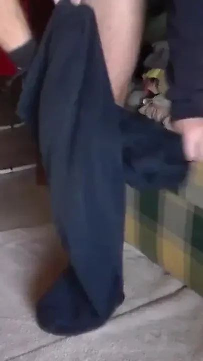 John is pissing on the sofa