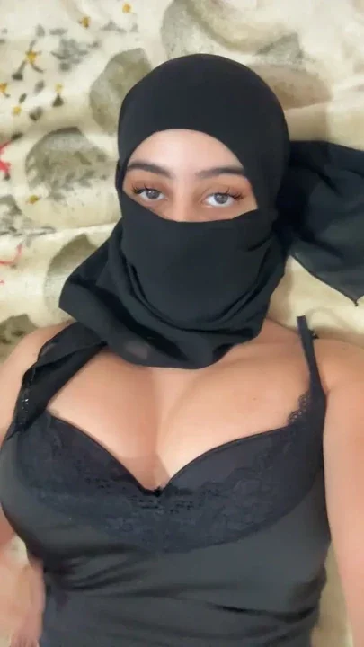 Muslim Girl in Hijab Lays in Bed and Gently Squeezes Her Arab Boobs While Her