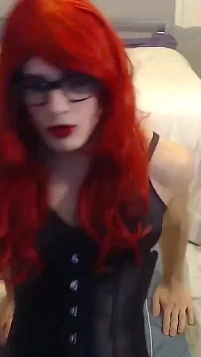 Kinky little red head in her black satin underbust corset seamed stockings heels