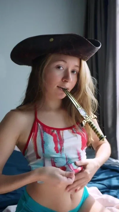 A young girl loves to flirt with her small tits