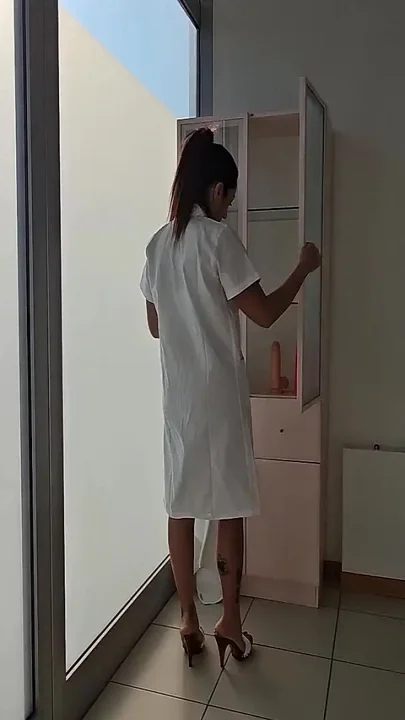Sexy Doctor Masturbates on the Bed While Waiting for Her Patient