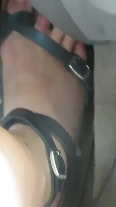 Revving Close up of my sandaled feet while I push the gas and break pedals