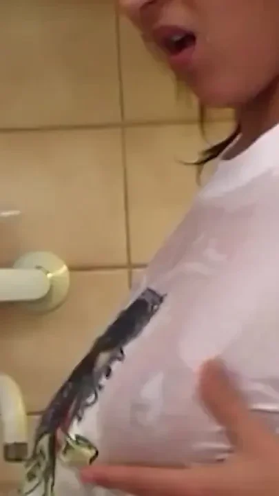 Busty babe sucking her own nipples